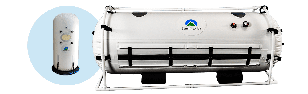 White hyperbaric chamber with oval shape on a metal frame, featuring 'Summit to Sea' logo. Smaller vertical control unit on a blue circle to the left.